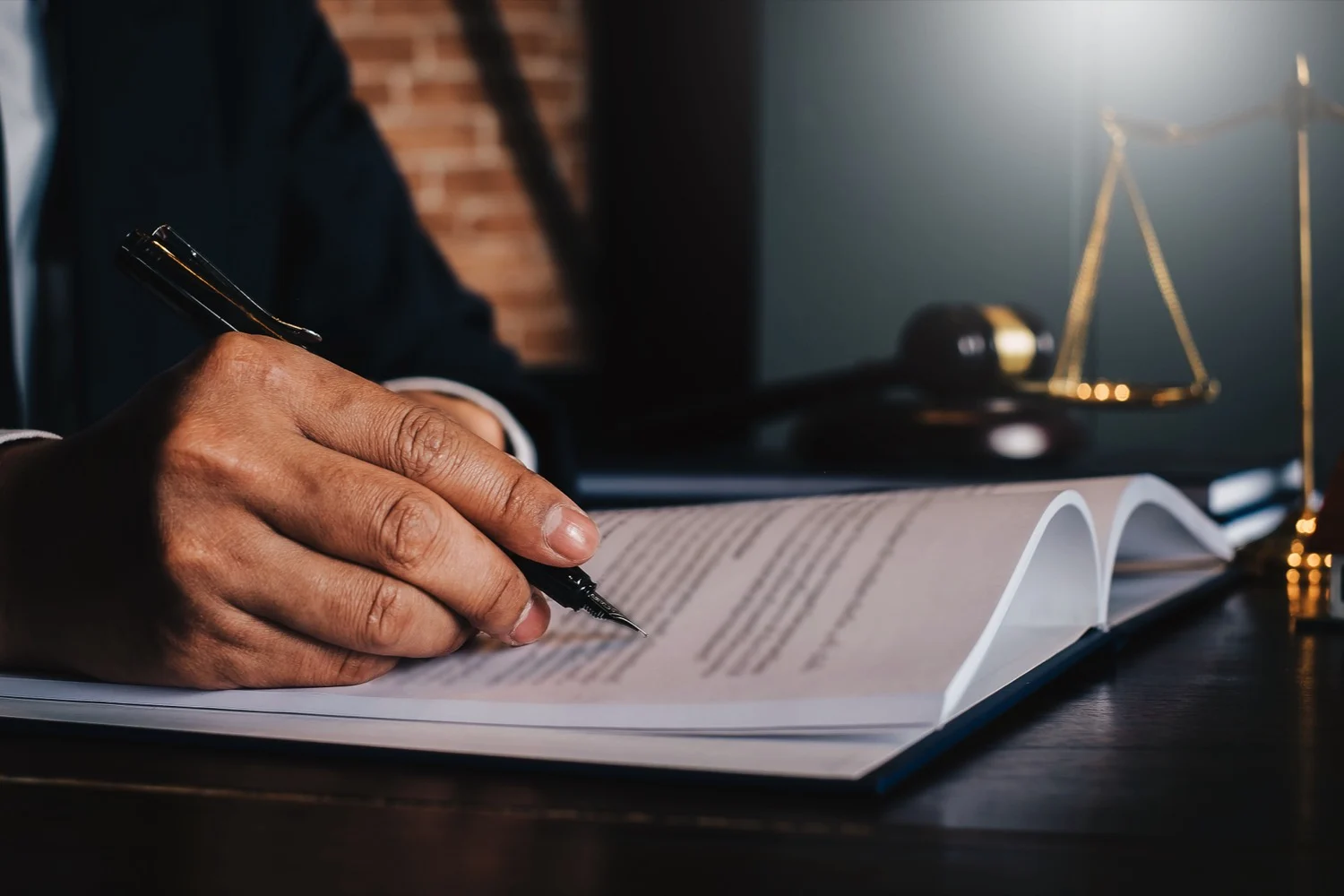 Lawyer reviews paperwork, contingency fee